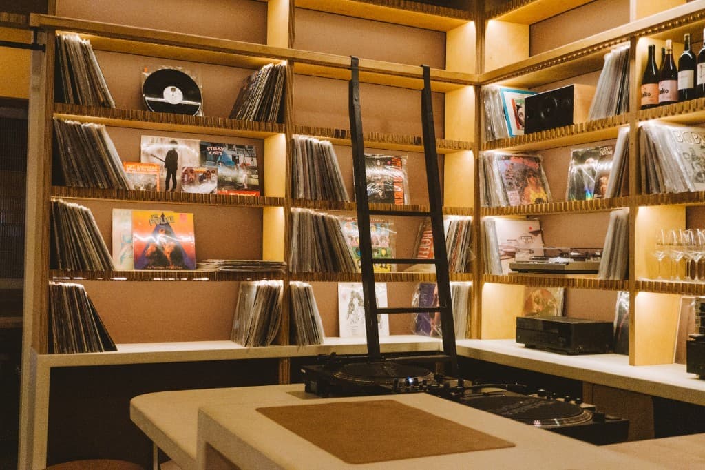 Vinyl record wall inside The Analogue Room listening lounge in Solvang