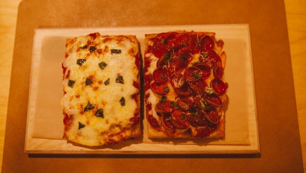 Cheese and pepperoni focaccia pizzas side by side at The Analogue Room in Solvang