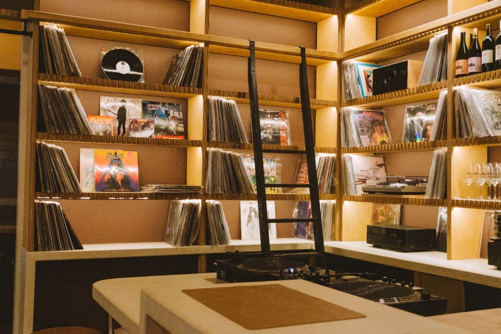 Vinyl record wall inside The Analogue Room listening lounge in Solvang