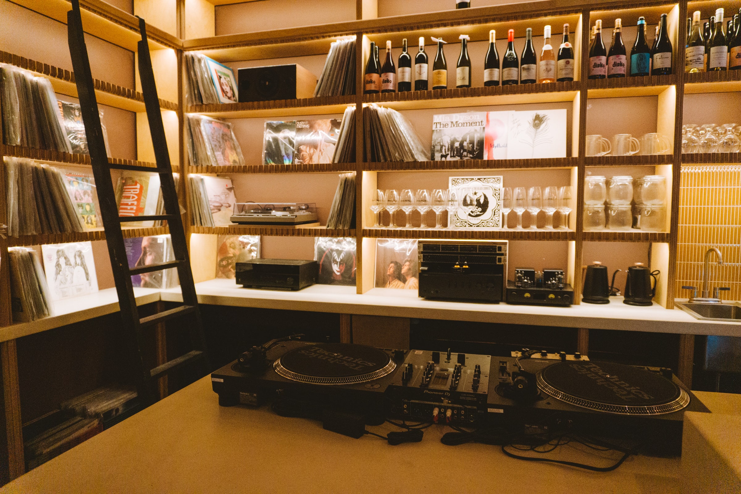 DJ booth and record wall at Analogue Room bar in Solvang