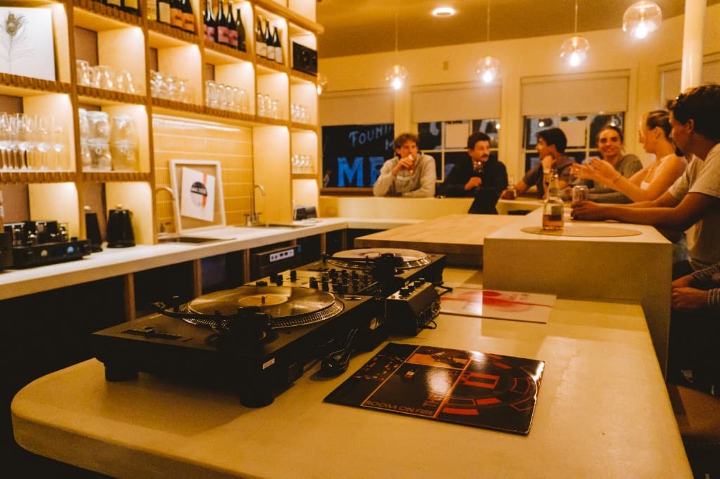 Guests and vinyl nightlife at The Analogue Room bar in Solvang